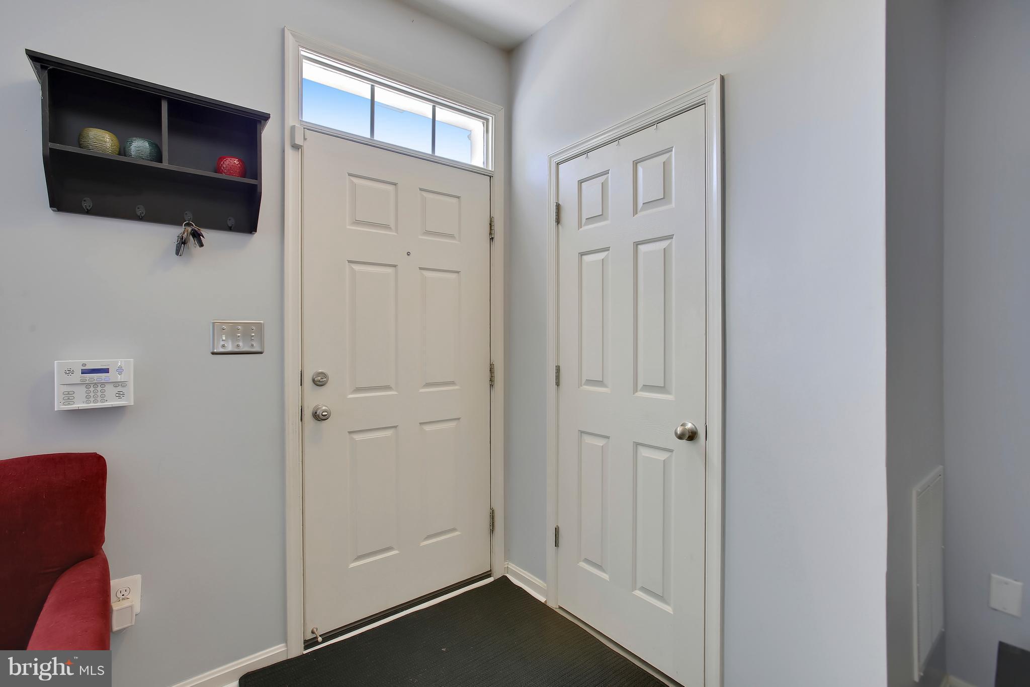 643 Tivoli Road Frederick, MD 21703 - Photo 4 of 30 a view of a livingroom with an empty space and a window