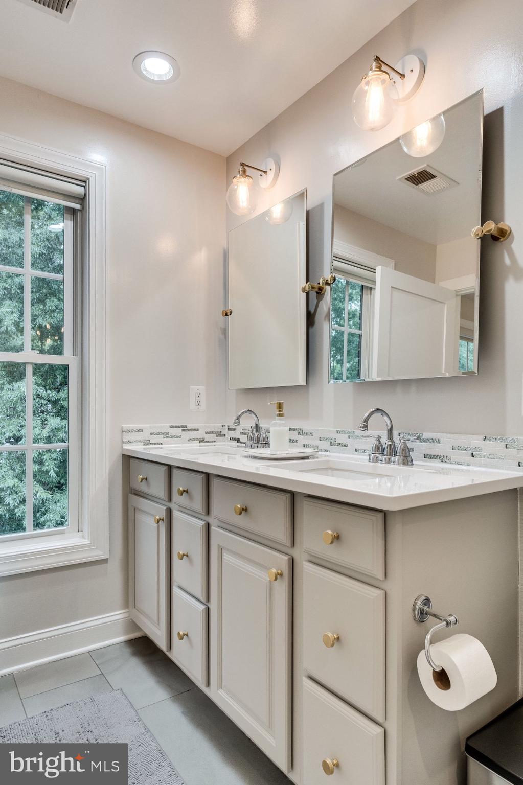 820 West Glebe Road Alexandria, VA 22305 - Photo 23 of 33 a bathroom with a sink and mirror