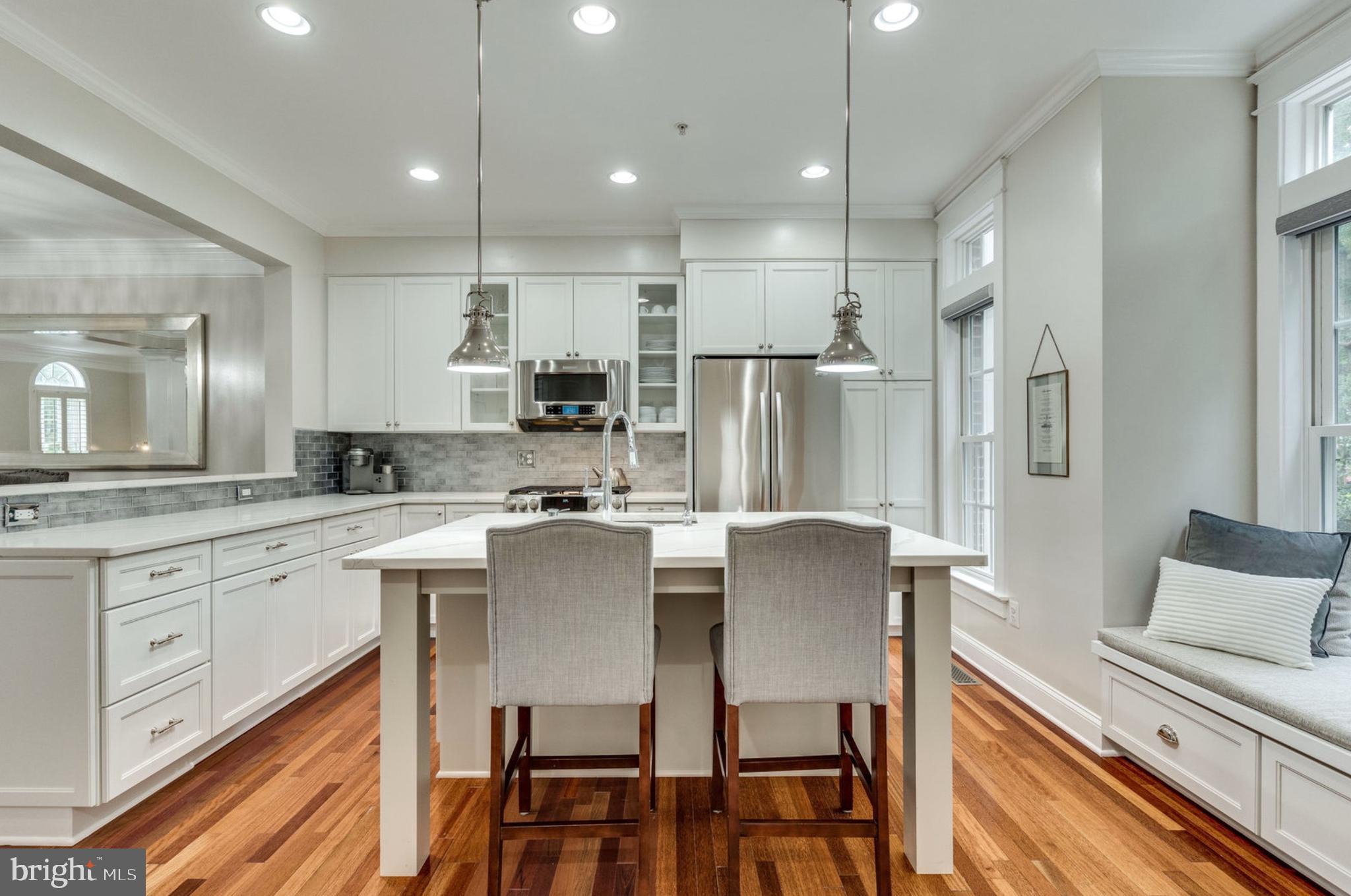 820 West Glebe Road Alexandria, VA 22305 - Photo 9 of 33 a large kitchen with a table and chairs