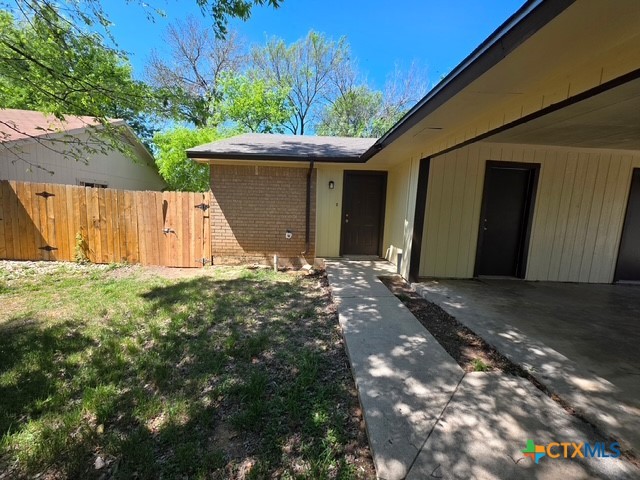 2010 South 15th Street, Unit B Temple, TX 76504 - Photo 11 of 12 a view of backyard with potted plants and a large tree