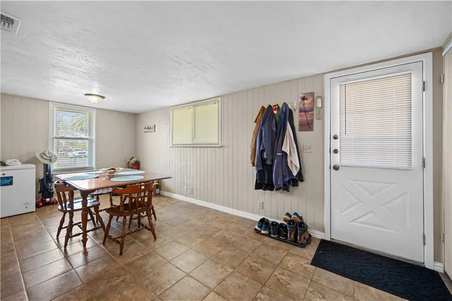 a view of a room with furniture and wooden floor