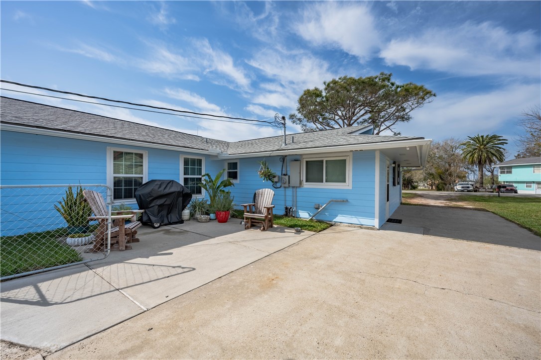 464 Sunset Ingleside, TX 78362 - Photo 28 of 35 a view of a patio with table and chairs and potted plants