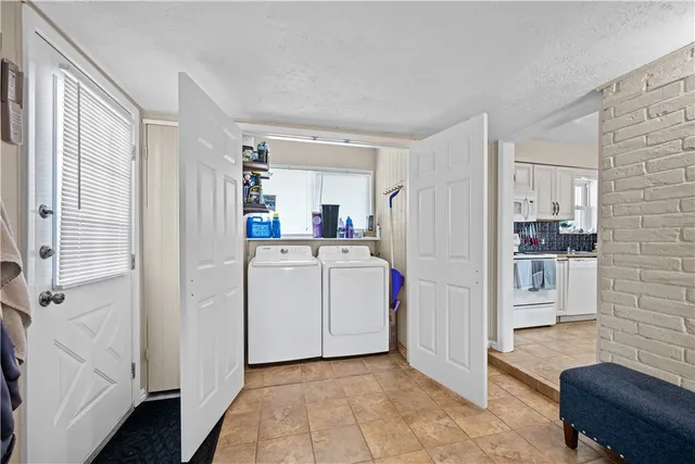 a kitchen with cabinets and white appliances