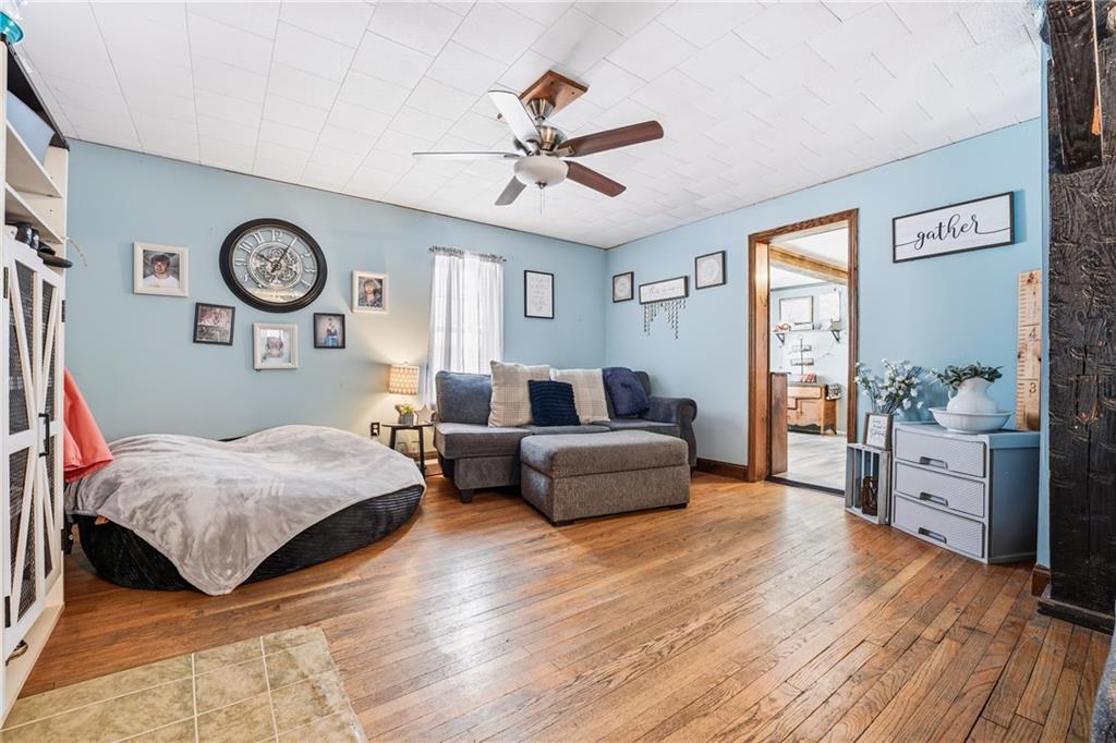 117 Erie Street Polk, PA 16342 - Photo 13 of 35 a bedroom with a bed and a chandelier