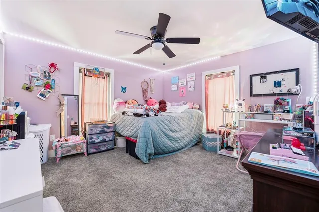 a bed room with a bed and a couch