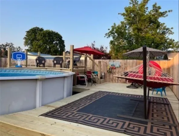 a wooden bench sitting in the middle of a park