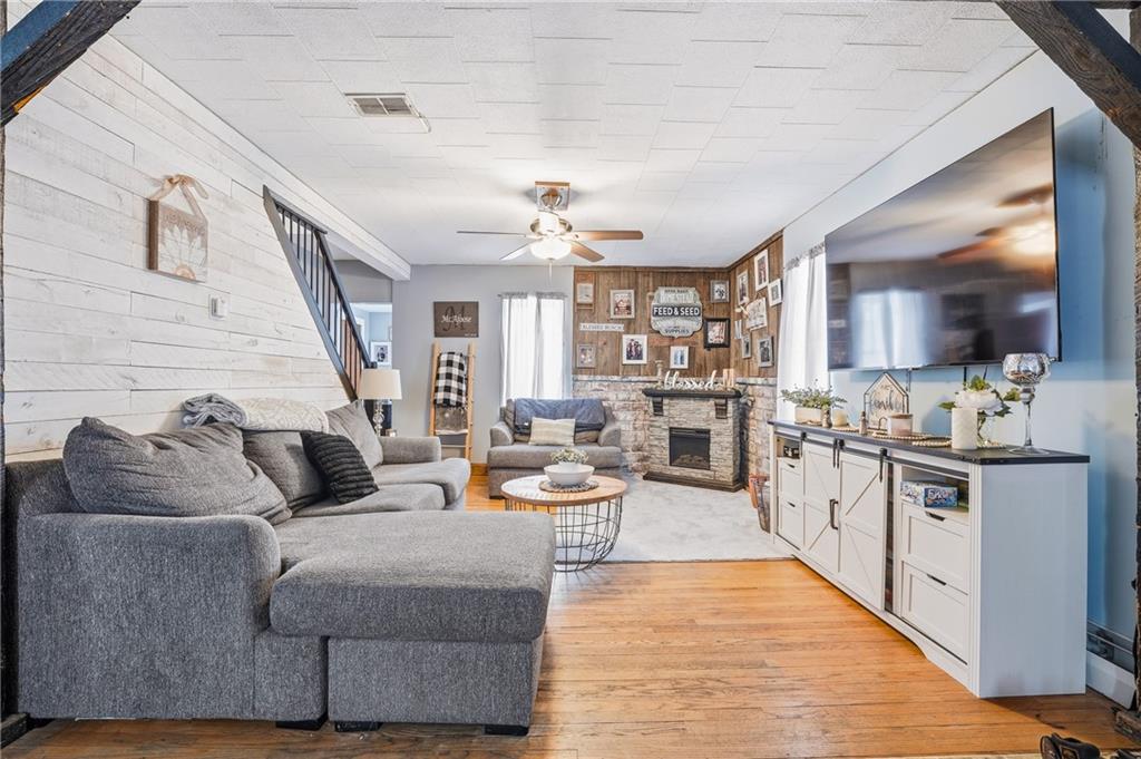 117 Erie Street Polk, PA 16342 - Photo 6 of 35 a living room with stainless steel appliances furniture a rug and a kitchen view