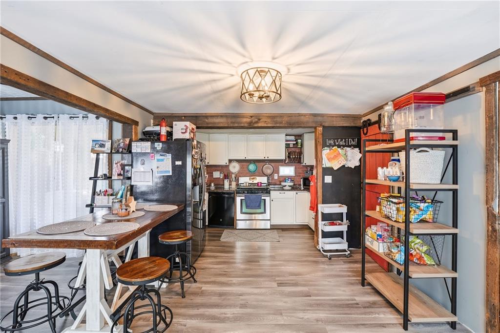 117 Erie Street Polk, PA 16342 - Photo 9 of 35 a view of a dining room with furniture and wooden floor