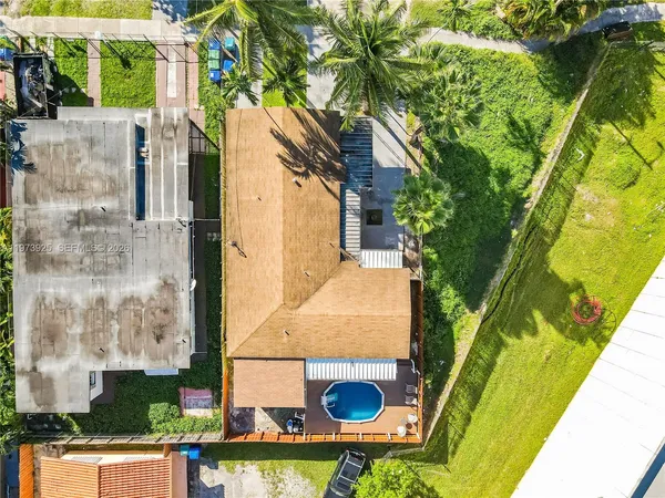 a aerial view of a house with swimming pool