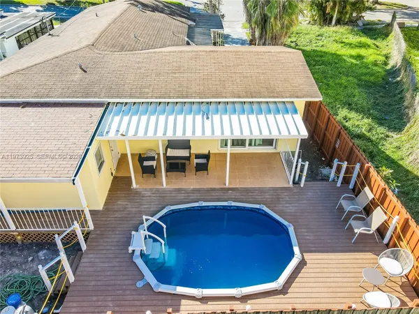 a view of a swimming pool with sitting space