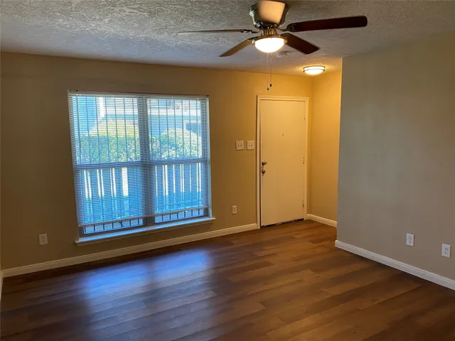 a view of room with wooden floor