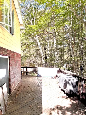 a view of balcony with wooden fence