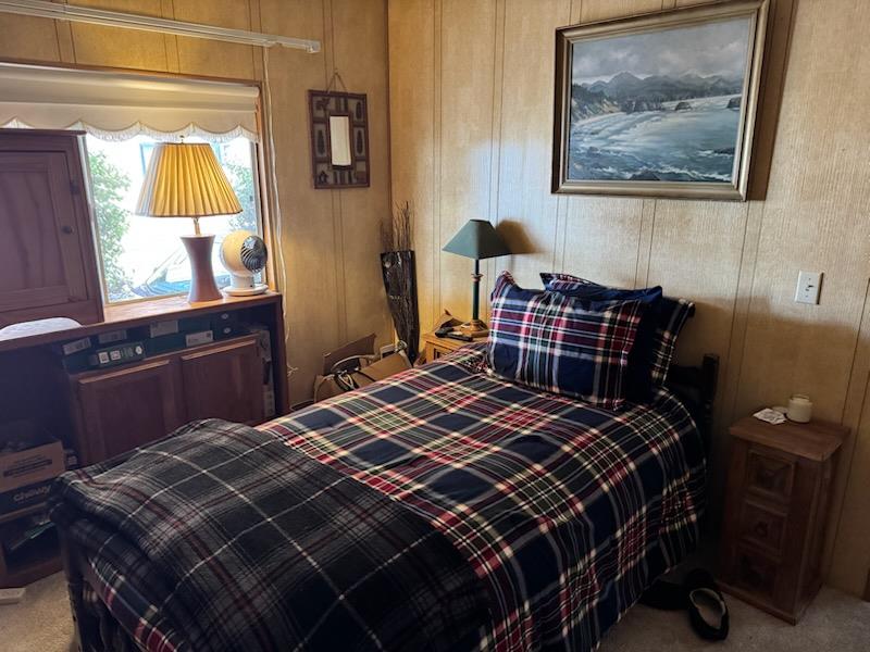 4420 Pleasant Valley Road, Unit 130 Diamond Springs, CA 95619 - Photo 23 of 39 a bedroom with a bed and wooden floor