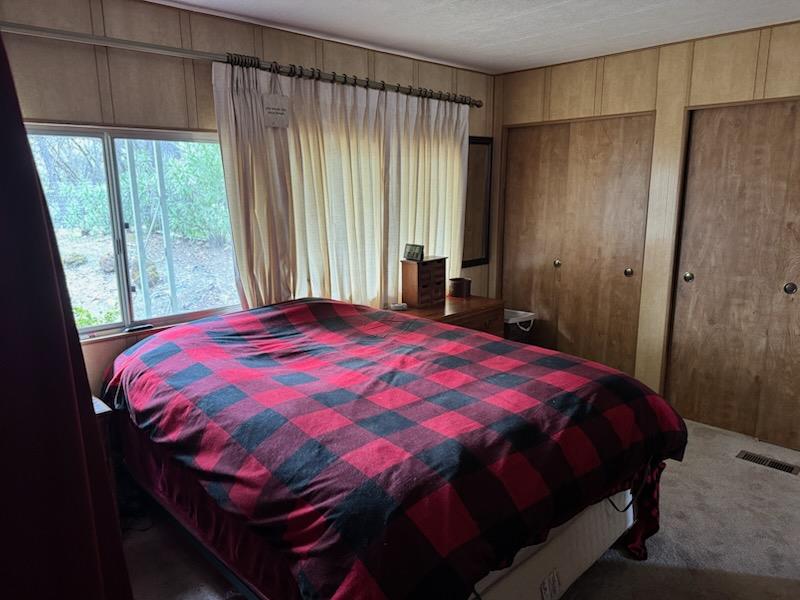 4420 Pleasant Valley Road, Unit 130 Diamond Springs, CA 95619 - Photo 25 of 39 a bedroom with a bed and a window