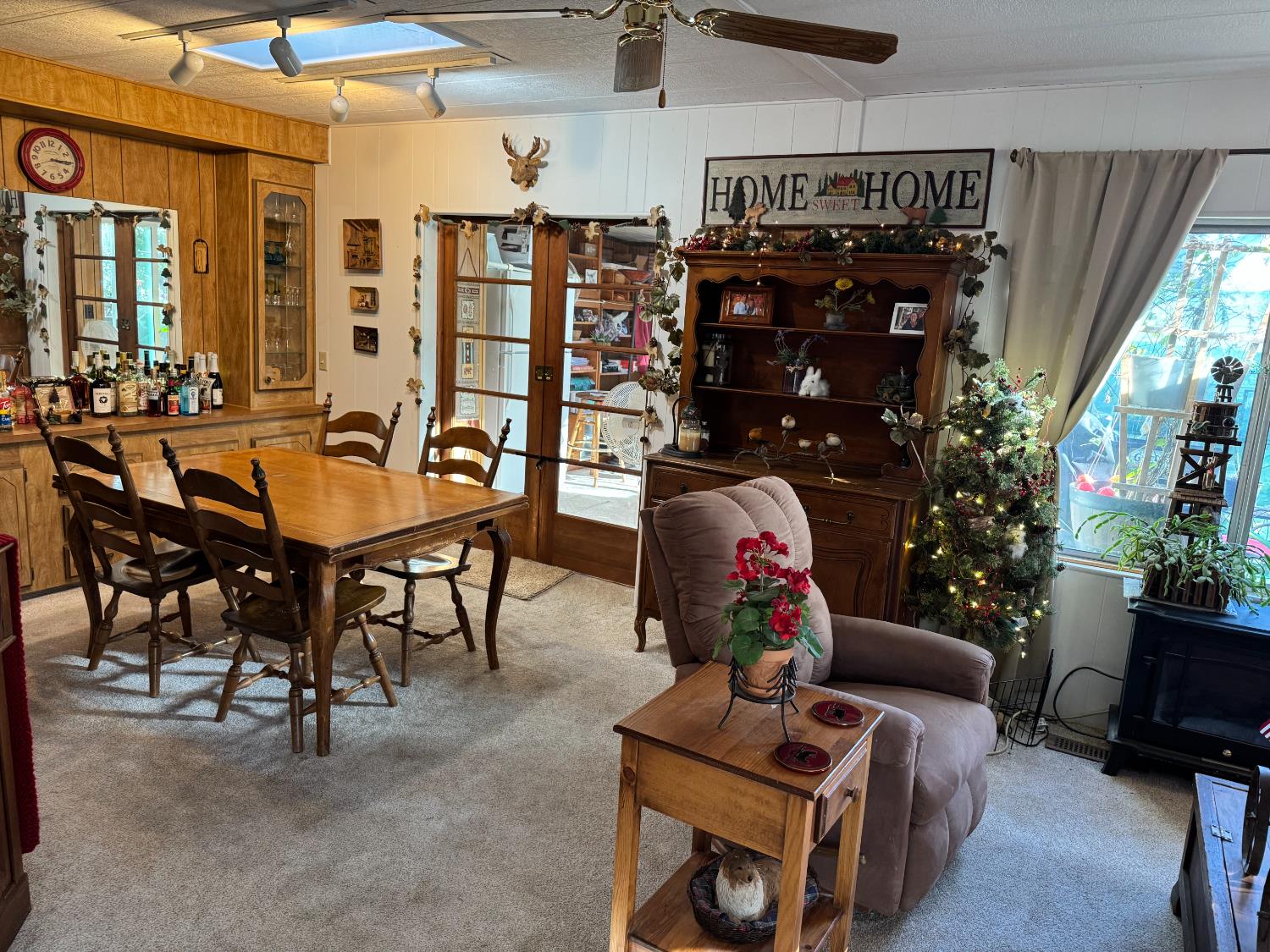 4420 Pleasant Valley Road, Unit 130 Diamond Springs, CA 95619 - Photo 30 of 39 a living room with lots of furniture and a chandelier