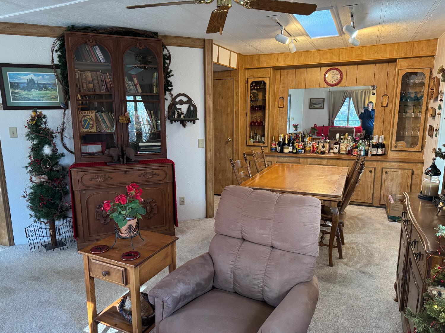 4420 Pleasant Valley Road, Unit 130 Diamond Springs, CA 95619 - Photo 32 of 39 a living room with furniture a flat screen tv and a floor to ceiling window