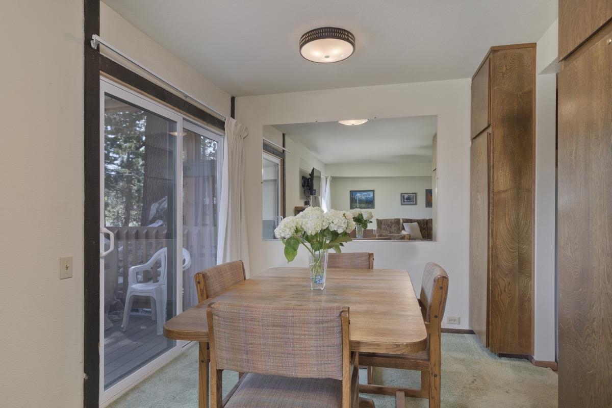 25 Lee Road, Unit 111 Mammoth Lakes, CA 93546 - Photo 11 of 32 a view of a dining room with furniture and a potted plant