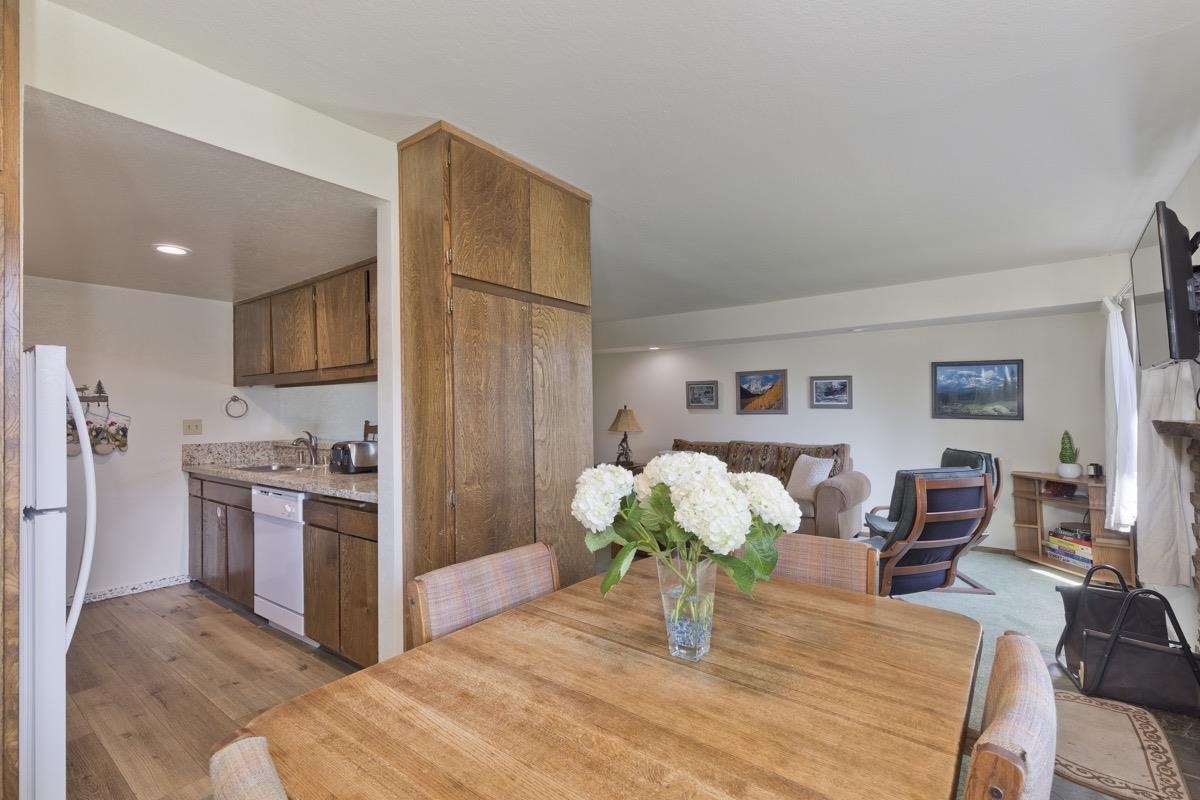 25 Lee Road, Unit 111 Mammoth Lakes, CA 93546 - Photo 13 of 32 a kitchen with stainless steel appliances granite countertop a refrigerator and stove