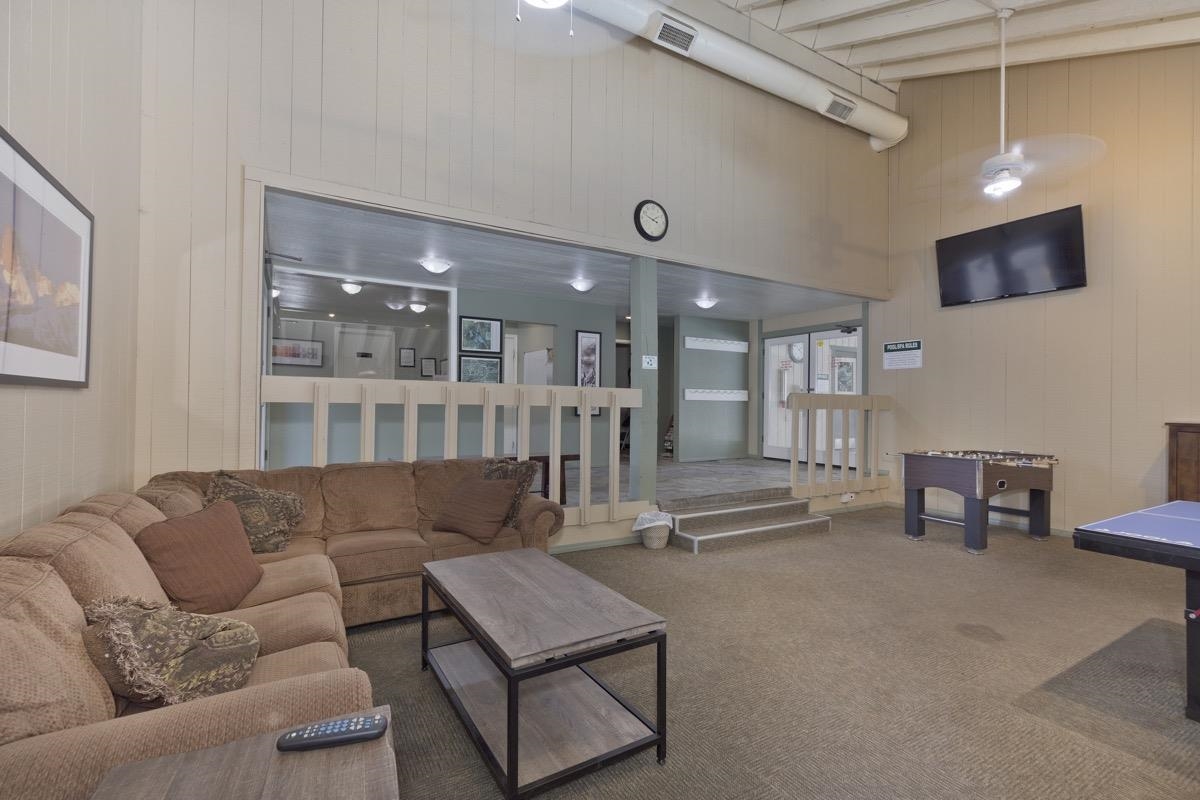 25 Lee Road, Unit 111 Mammoth Lakes, CA 93546 - Photo 30 of 32 a living room with furniture and a flat screen tv