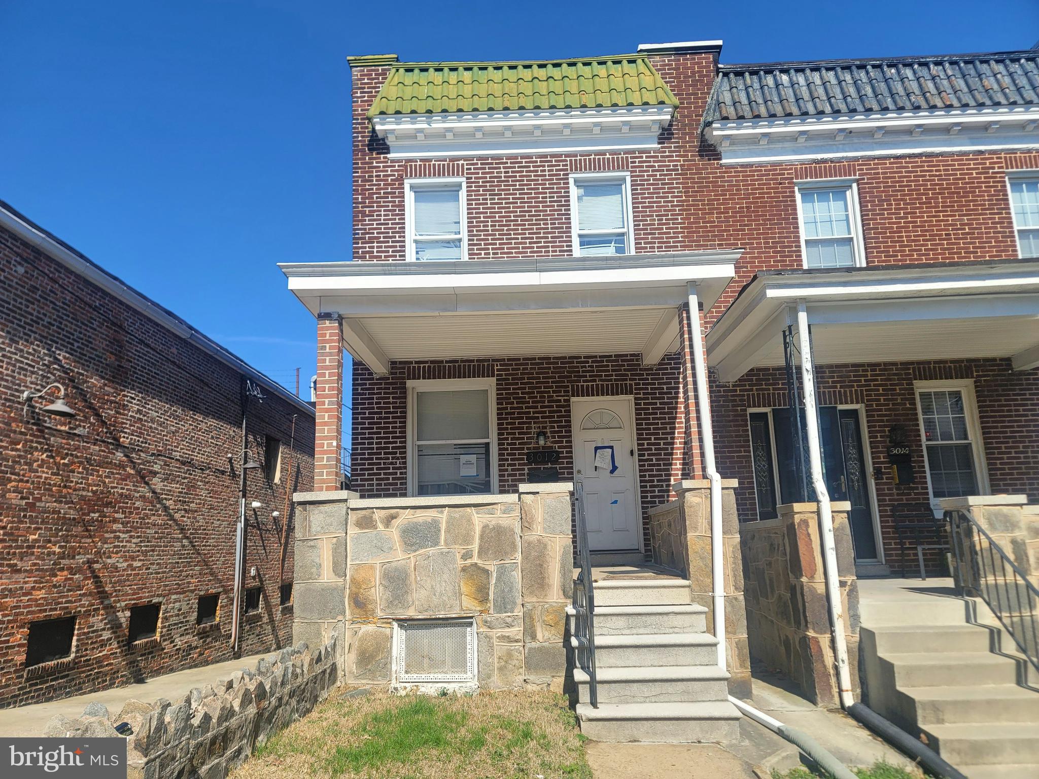 3012 Kentucky Avenue Baltimore, MD 21213 - Photo 1 of 20 front view of a house with a small yard