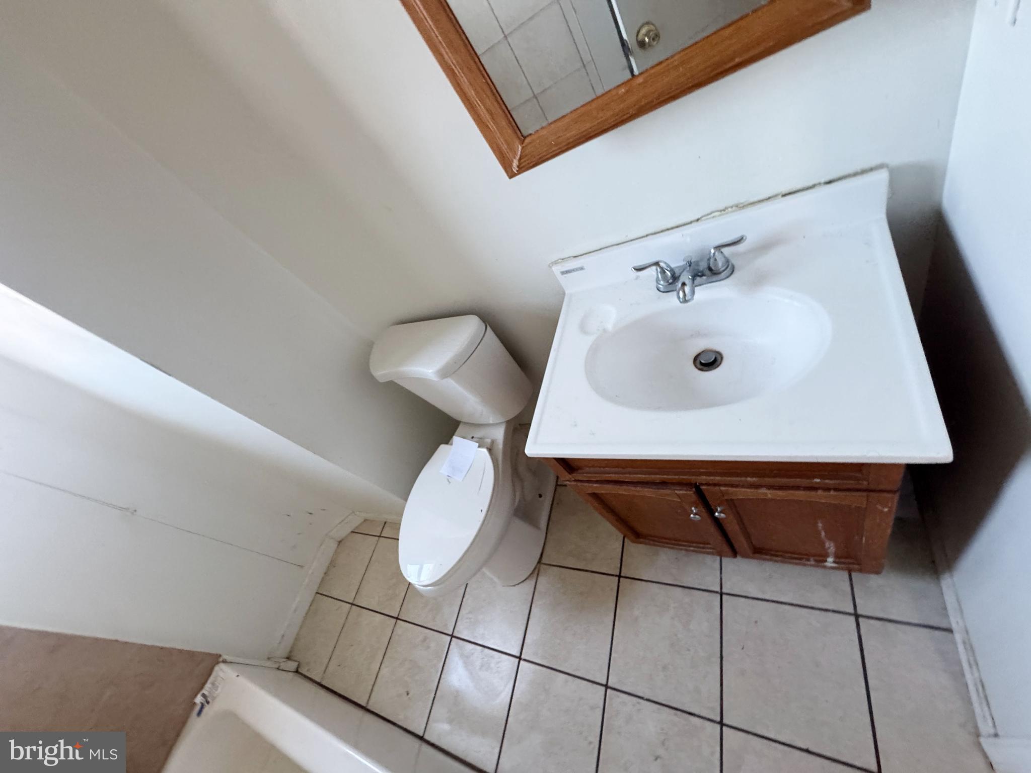 3012 Kentucky Avenue Baltimore, MD 21213 - Photo 14 of 20 a bathroom with a sink and a toilet