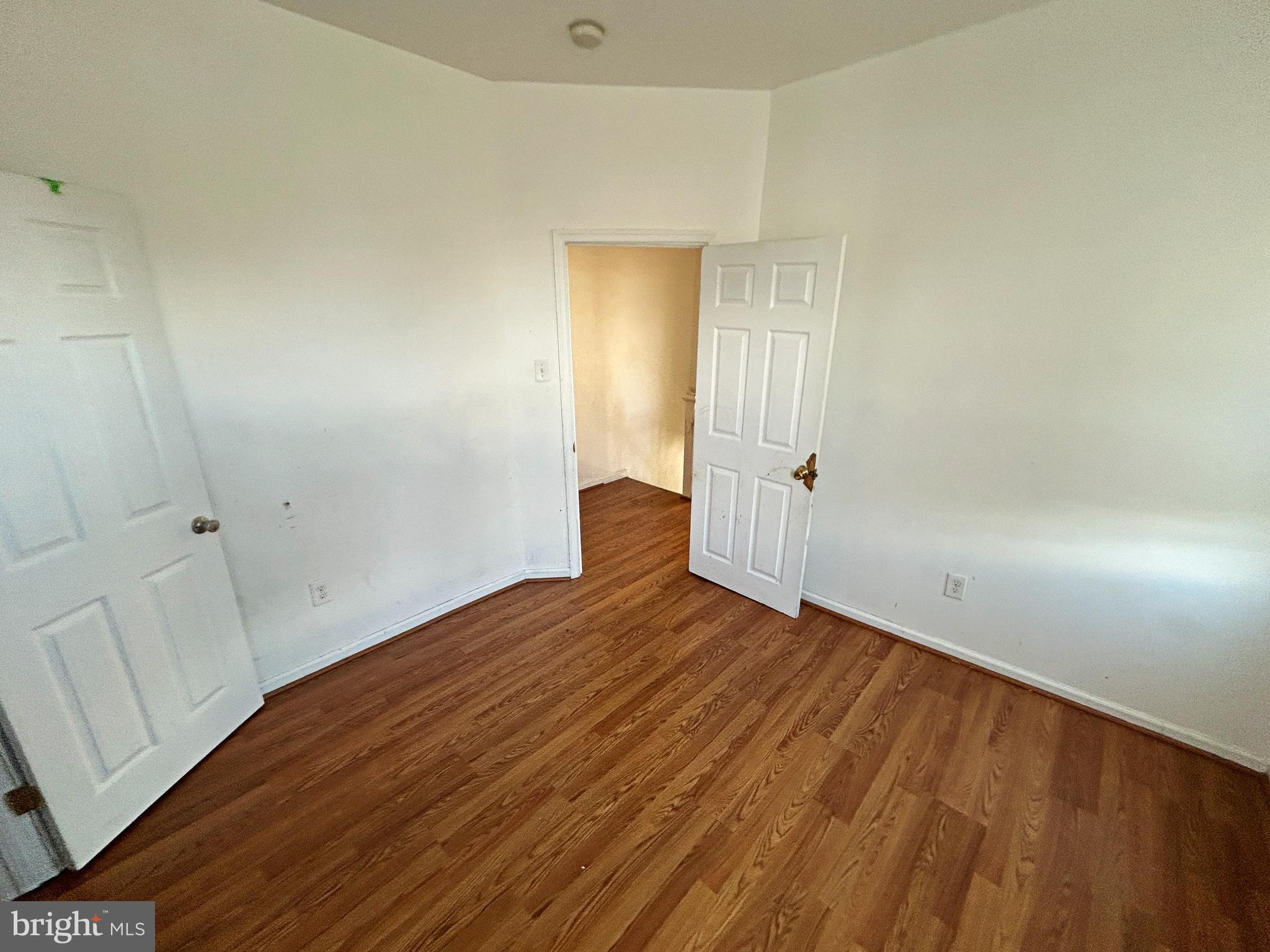 3012 Kentucky Avenue Baltimore, MD 21213 - Photo 17 of 20 a view of an empty room with wooden floor and closet