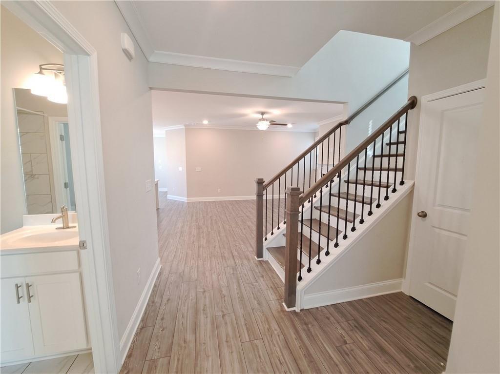 637 Stan Hope Lane Suwanee, GA 30024 - Photo 11 of 44 a view of entryway and hall with wooden floor