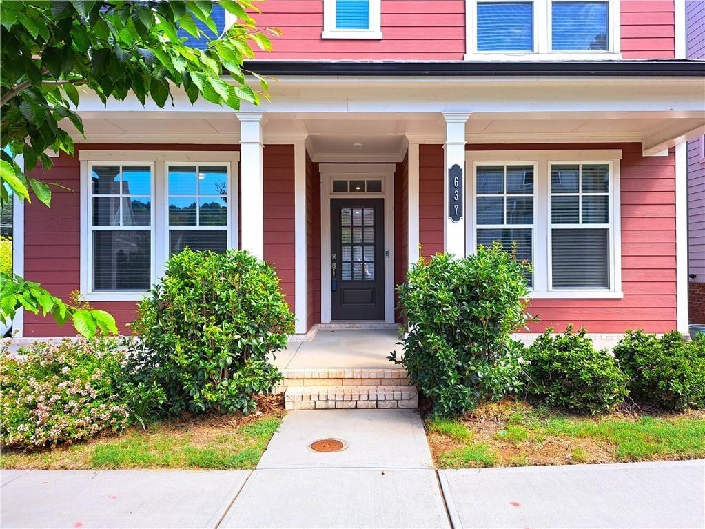 637 Stan Hope Lane Suwanee, GA 30024 - Photo 2 of 44 a view of a house with potted plants and a bench