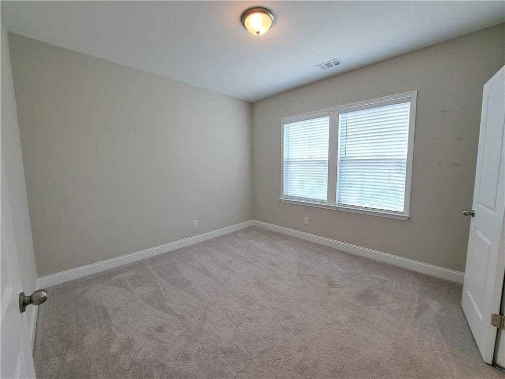 637 Stan Hope Lane Suwanee, GA 30024 - Photo 23 of 44 an empty room with a window