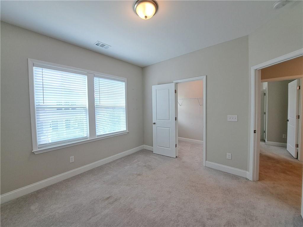 637 Stan Hope Lane Suwanee, GA 30024 - Photo 24 of 44 a view of an empty room with a window