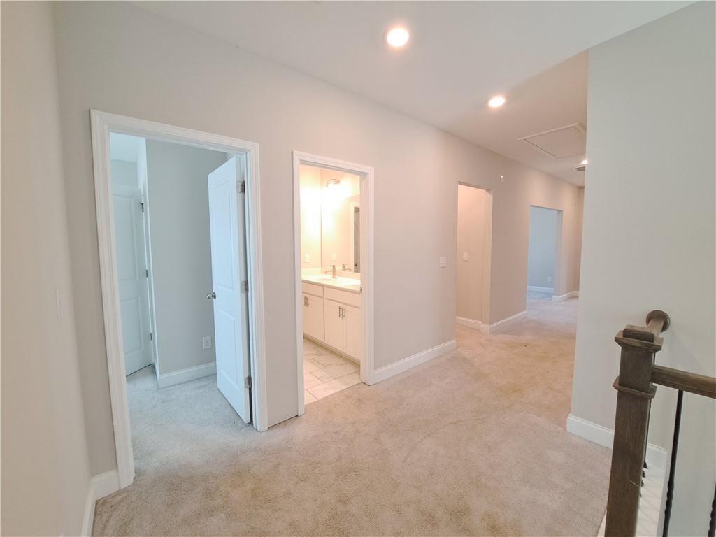 637 Stan Hope Lane Suwanee, GA 30024 - Photo 26 of 44 a view of a room with an empty space and a gallery