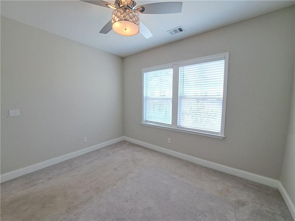 637 Stan Hope Lane Suwanee, GA 30024 - Photo 28 of 44 an empty room with a window