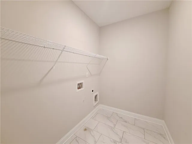 a view of a livingroom with a ceiling fan and window