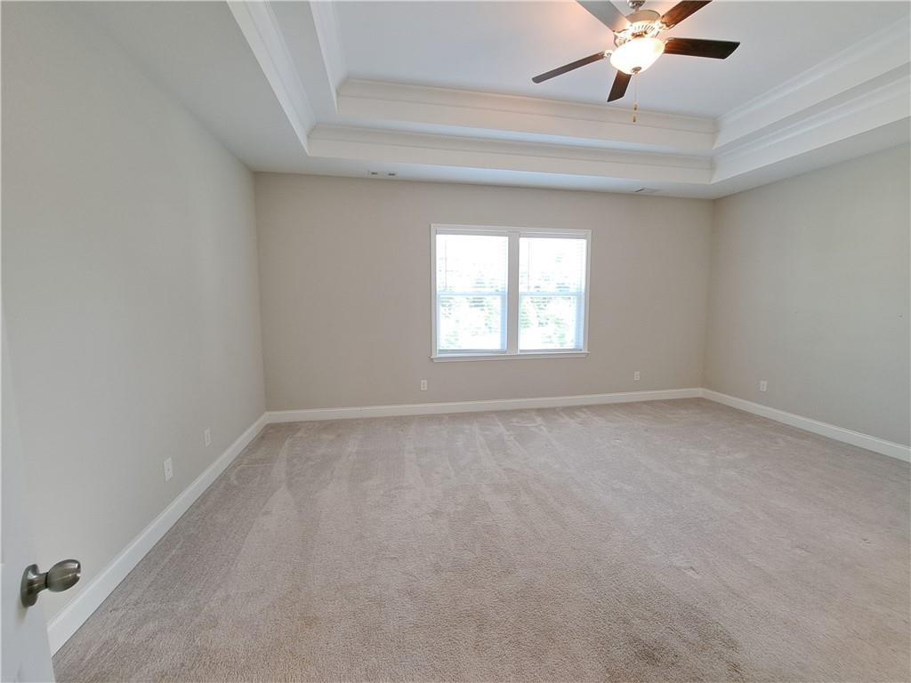 637 Stan Hope Lane Suwanee, GA 30024 - Photo 34 of 44 an empty room with a window and a fan