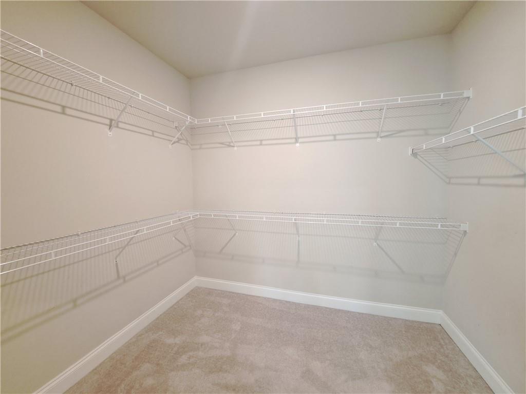 637 Stan Hope Lane Suwanee, GA 30024 - Photo 38 of 44 a view of a room with empty racks