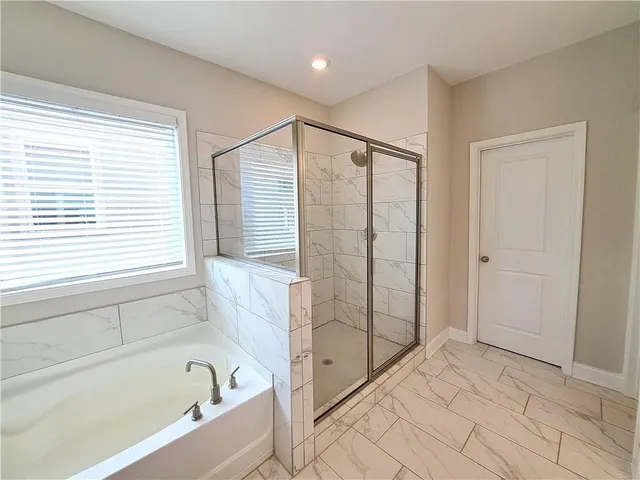 a spacious bathroom with a double vanity sink and a mirror