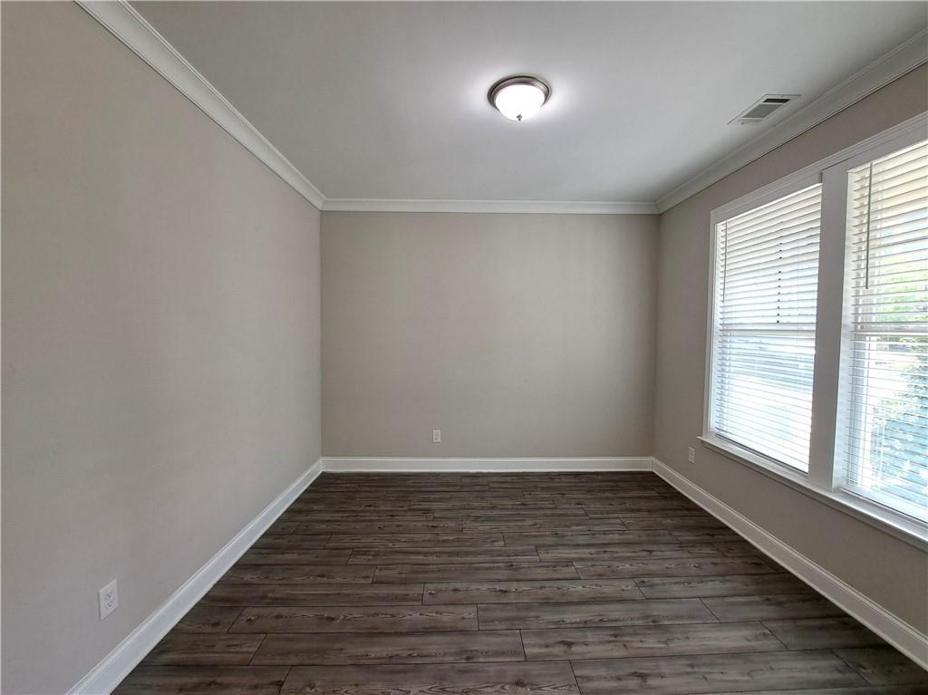 637 Stan Hope Lane Suwanee, GA 30024 - Photo 4 of 44 wooden floor in an empty room with a window