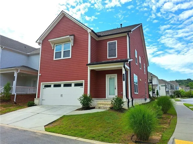 a front view of a house with a yard