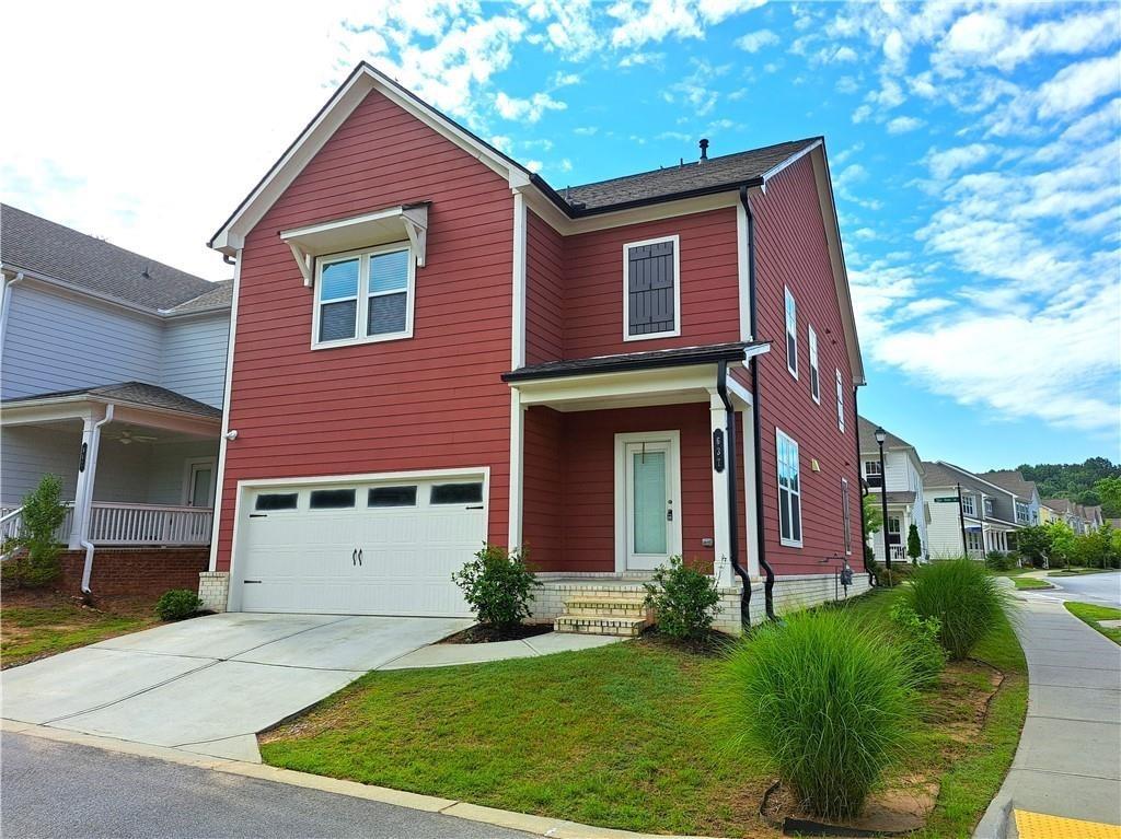 637 Stan Hope Lane Suwanee, GA 30024 - Photo 42 of 44 a front view of a house with a yard