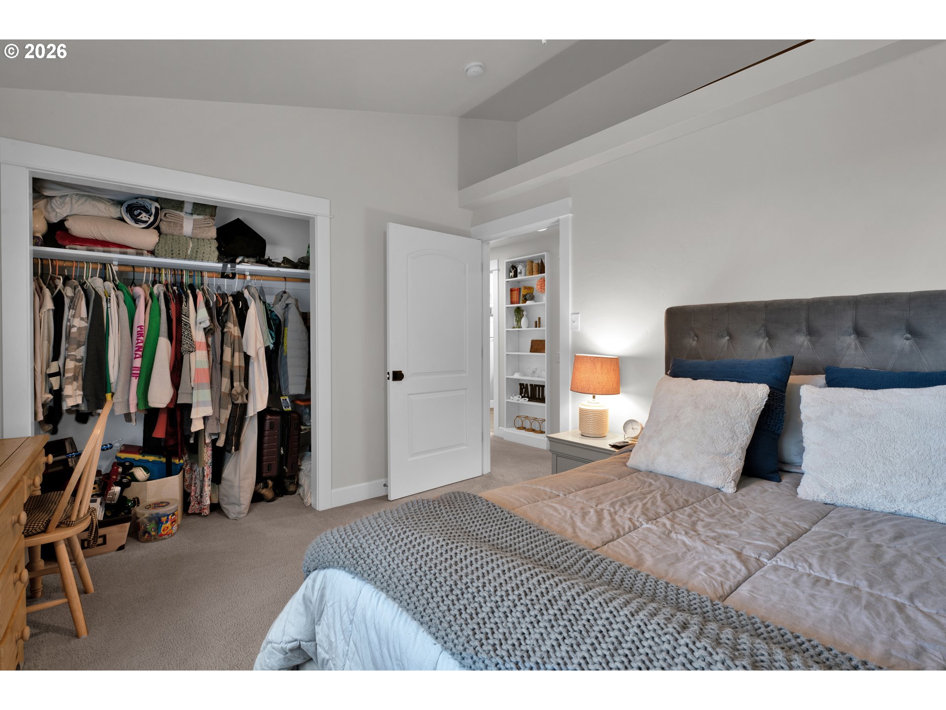 91606 Coburg Road Eugene, OR 97408 - Photo 16 of 30 a bedroom with a large bed and a walk in closet
