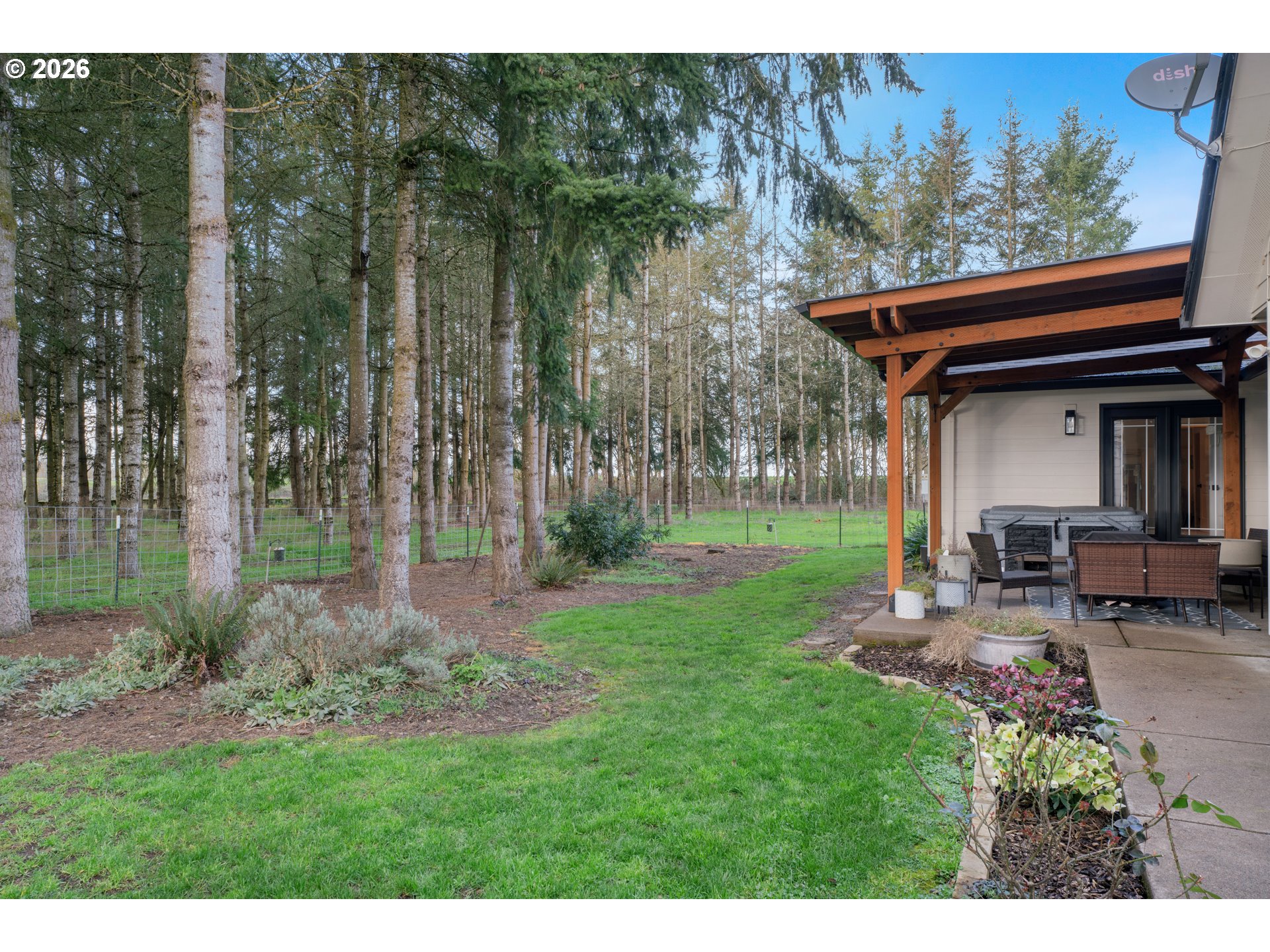 91606 Coburg Road Eugene, OR 97408 - Photo 25 of 30 a view of a chair and table in backyard of the house