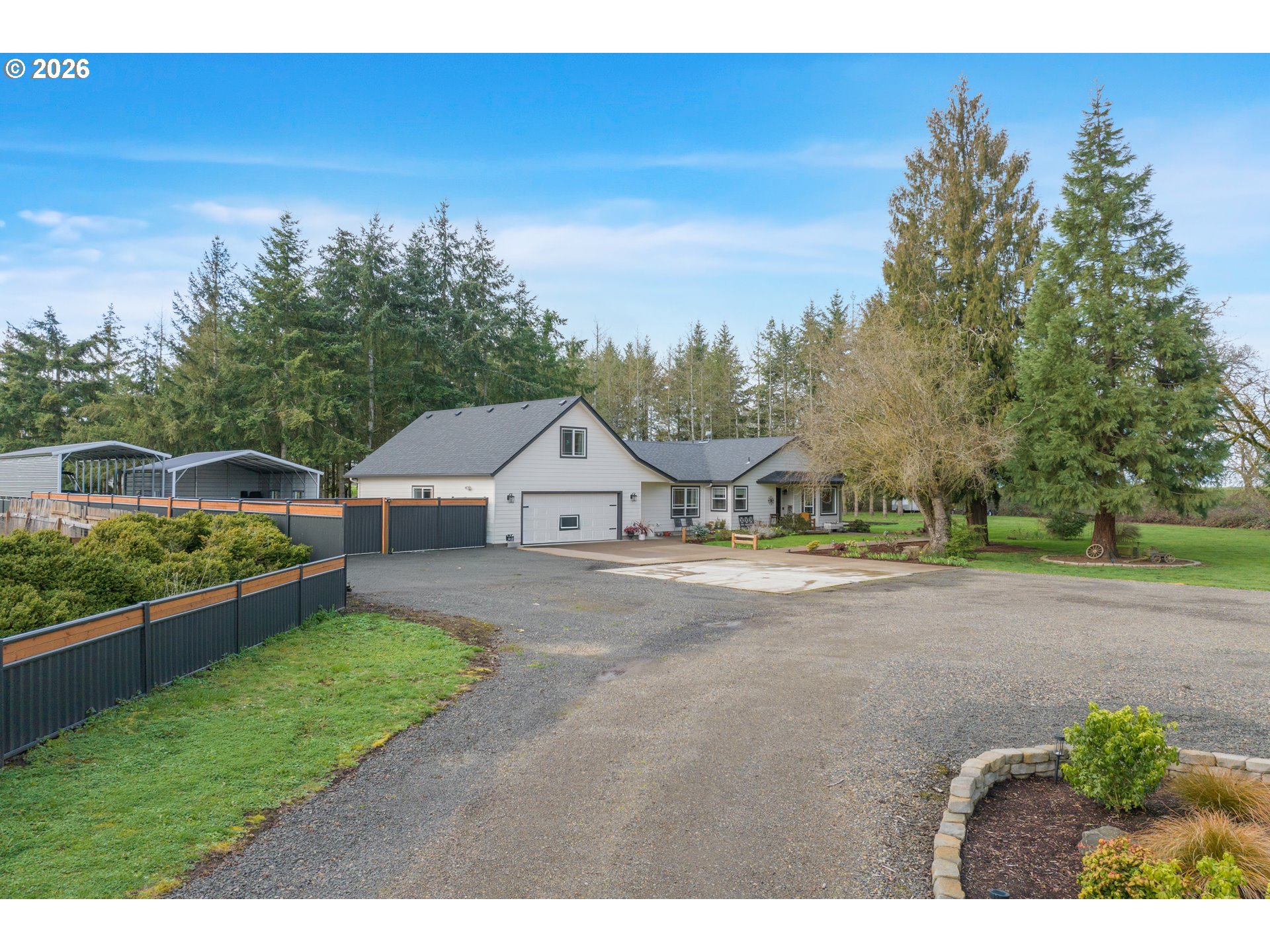 91606 Coburg Road Eugene, OR 97408 - Photo 3 of 30 a view of a house with a big yard plants and large trees