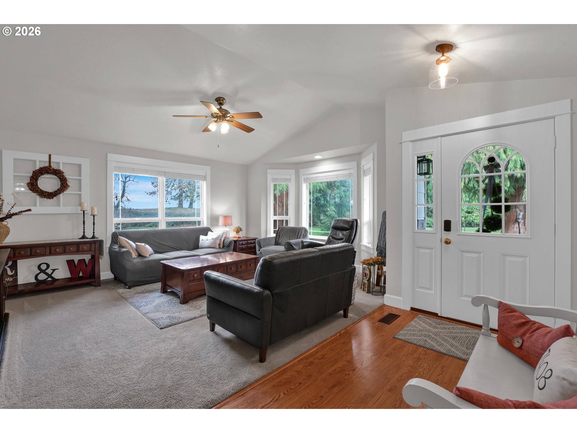 91606 Coburg Road Eugene, OR 97408 - Photo 5 of 30 a living room with furniture and a chandelier