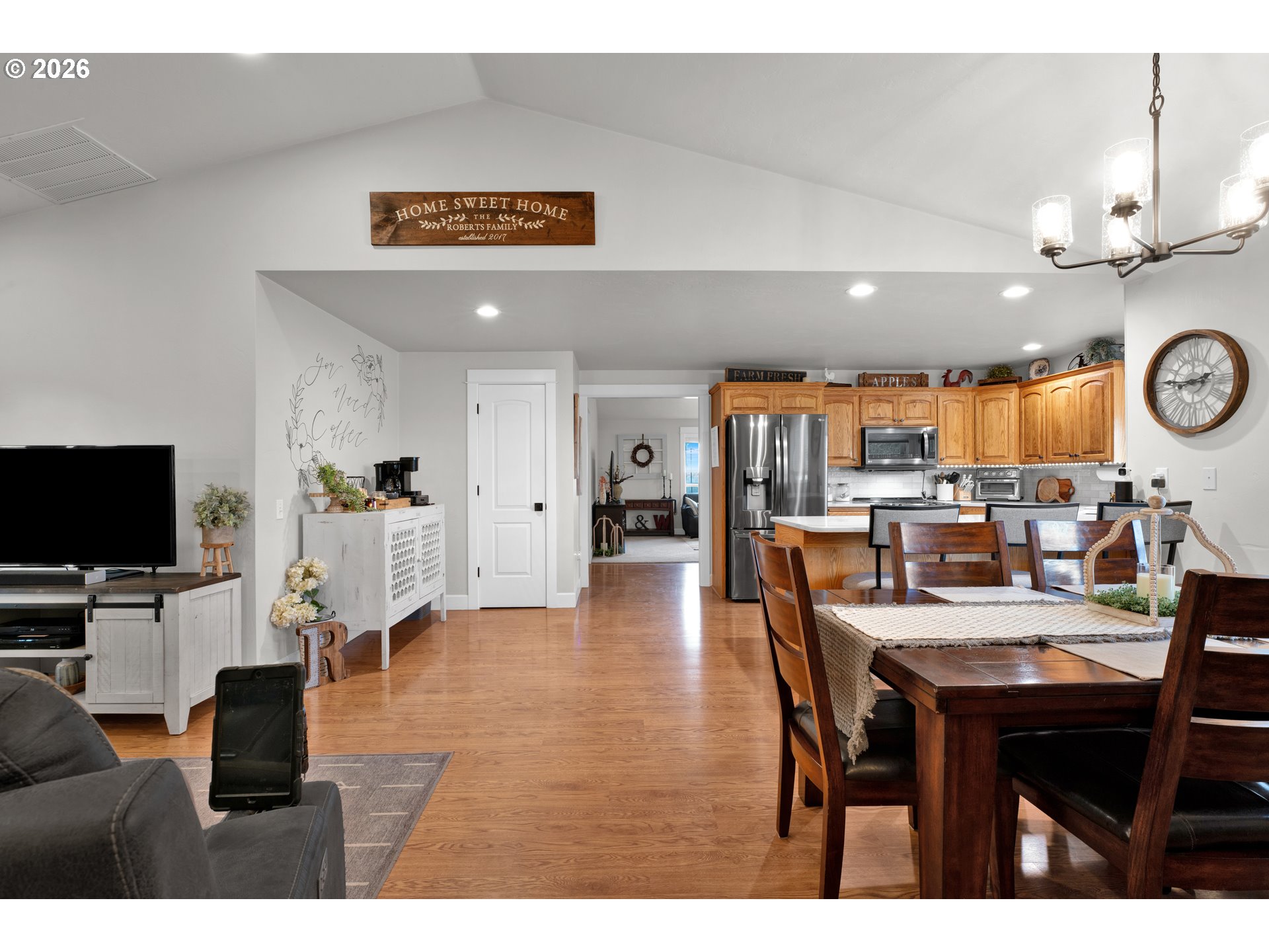 91606 Coburg Road Eugene, OR 97408 - Photo 6 of 30 a view of a dining area with furniture and a flat screen tv