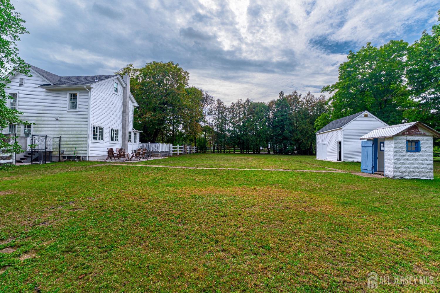 300 Blackpoint Road Neshanic Station, NJ 08853 - Photo 11 of 34 a front view of a house with garden