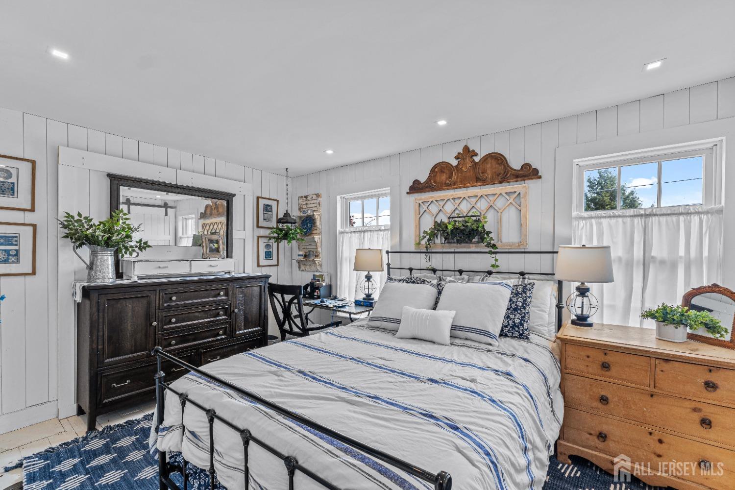 300 Blackpoint Road Neshanic Station, NJ 08853 - Photo 16 of 34 a bedroom with furniture and paintings on the wall