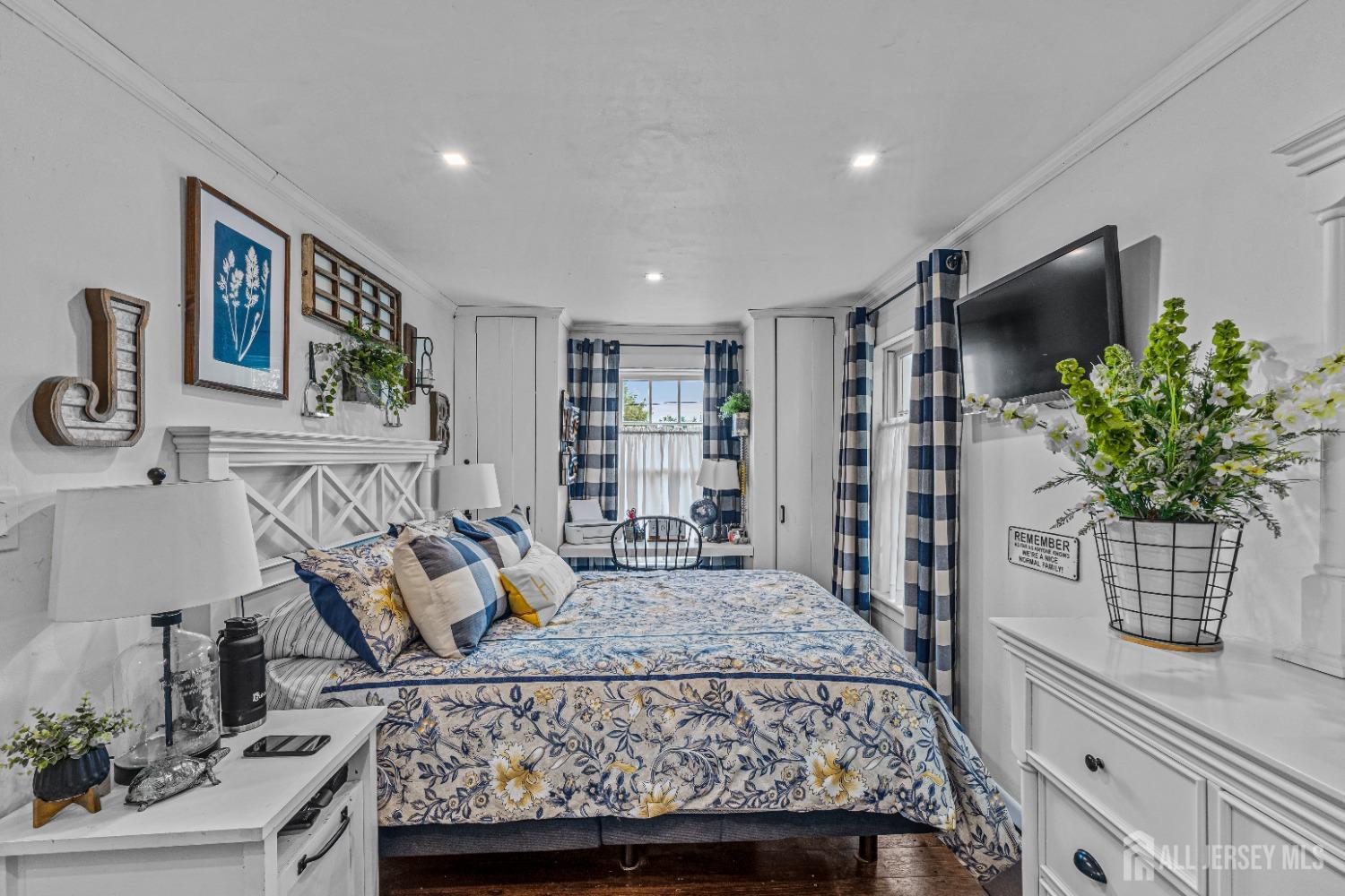 300 Blackpoint Road Neshanic Station, NJ 08853 - Photo 21 of 34 a bedroom with a large bed and a flat screen tv