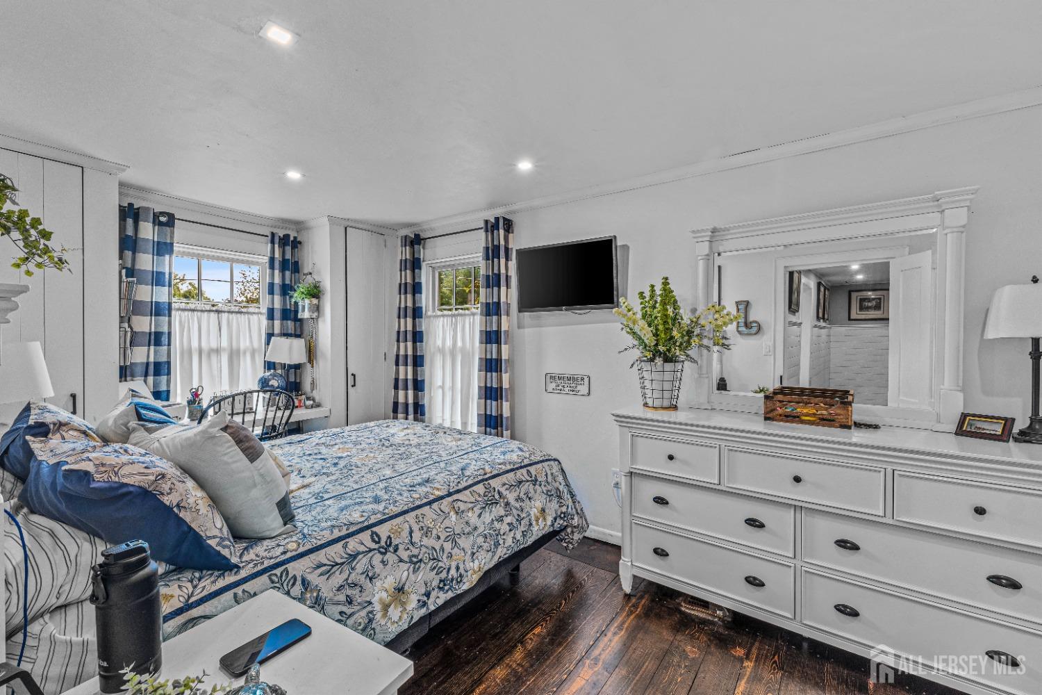 300 Blackpoint Road Neshanic Station, NJ 08853 - Photo 22 of 34 a bedroom with a large bed and a flat screen tv