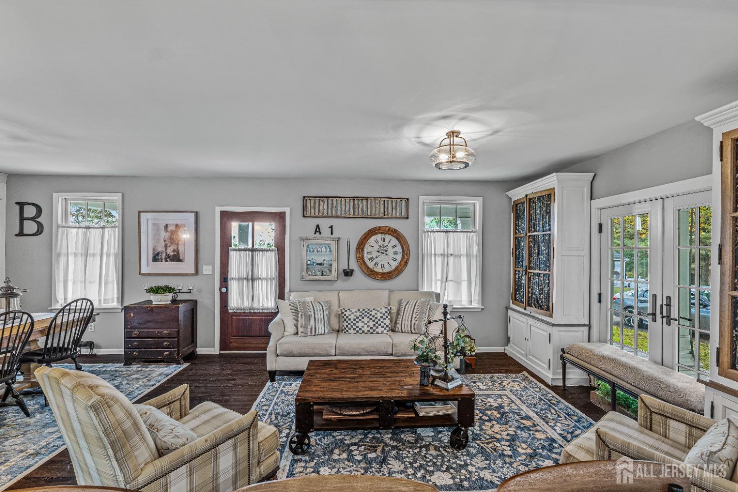 300 Blackpoint Road Neshanic Station, NJ 08853 - Photo 25 of 34 a living room with furniture a clock and a large window