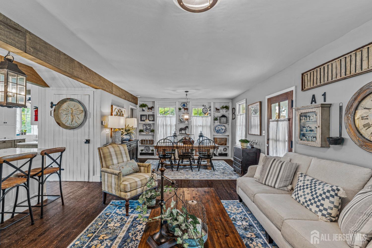 300 Blackpoint Road Neshanic Station, NJ 08853 - Photo 26 of 34 a living room with furniture and a clock